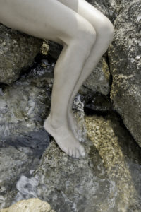 Naked legs of a girl, shore Naked legs of a girl, shore